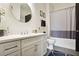 Well-lit bathroom featuring a large vanity and a shower-tub combo with modern fixtures at 625 Piedmont Ne Ave # 3028, Atlanta, GA 30308