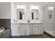 Bright bathroom features double vanity with a large countertop, shower and soaking tub at 625 Piedmont Ne Ave # 3028, Atlanta, GA 30308