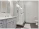 Bathroom with a modern glass shower, white vanity, and gray tile flooring at 625 Piedmont Ne Ave # 3028, Atlanta, GA 30308