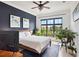 Bedroom with a navy accent wall, a large window and lots of natural light at 625 Piedmont Ne Ave # 3028, Atlanta, GA 30308