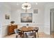 Dining room features a round wooden table, seating for four and detailed trim work at 625 Piedmont Ne Ave # 3028, Atlanta, GA 30308