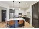 Modern kitchen features stainless appliances, a central island with bar stool seating, and white and grey cabinets at 625 Piedmont Ne Ave # 3028, Atlanta, GA 30308