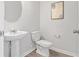 Elegant powder room with a pedestal sink, modern fixtures, and minimalist decor at 7021 Old Bridge Ln, Conyers, GA 30013