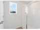 Bathroom showcasing a glass-enclosed shower with natural light streaming through the window at 986 Sutherland Ln (Lot 32), Lawrenceville, GA 30043