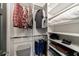 Walk-in closet with custom shelving and hanging rods provides ample storage space at 1074 Fairway Ne Ests, Atlanta, GA 30319