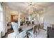 Charming dining area with a rustic table, stylish chairs, and elegant lighting at 1074 Fairway Ne Ests, Atlanta, GA 30319