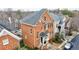 Charming brick townhome featuring a classic design with beautiful arched windows and a well-manicured front yard at 1074 Fairway Ne Ests, Atlanta, GA 30319