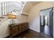 Inviting foyer with hardwood floors, staircase, and rustic storage cabinet at 1074 Fairway Ne Ests, Atlanta, GA 30319