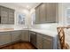 Beautiful modern kitchen features stylish gray cabinetry and white countertops at 1074 Fairway Ne Ests, Atlanta, GA 30319