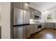 Beautiful stainless steel appliances and well-lit gray cabinets highlight this spacious modern kitchen at 1074 Fairway Ne Ests, Atlanta, GA 30319