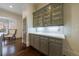 Kitchen cabinets are enhanced by a white counter and a decorative glass insert at 1074 Fairway Ne Ests, Atlanta, GA 30319