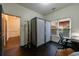 Cozy office space featuring wood floors, large windows, and a storage cabinet at 1074 Fairway Ne Ests, Atlanta, GA 30319