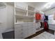 Organized walk-in closet featuring custom shelving, drawers, and storage solutions at 1074 Fairway Ne Ests, Atlanta, GA 30319