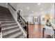 Spacious basement with carpeted stairs leading to a finished area with wood flooring at 112 Rocky Creek Trl, Woodstock, GA 30188