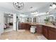 Bright Primary bathroom featuring dual vanities, granite countertops, and updated light fixtures at 112 Rocky Creek Trl, Woodstock, GA 30188