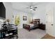 Bright bedroom featuring a ceiling fan, neutral walls, and natural lighting at 112 Rocky Creek Trl, Woodstock, GA 30188