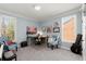 Stylish room featuring multiple musical instruments, desk and art piece at 112 Rocky Creek Trl, Woodstock, GA 30188