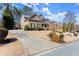 Beautiful two-story home with stone and siding exterior, landscaped yard, and a welcoming entrance at 112 Rocky Creek Trl, Woodstock, GA 30188