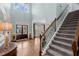 Spacious foyer with hardwood floors, a staircase, and plenty of natural light at 112 Rocky Creek Trl, Woodstock, GA 30188