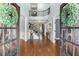 Grand foyer with soaring ceilings, hardwood floors, and an elegant staircase at 112 Rocky Creek Trl, Woodstock, GA 30188