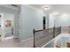 Second story hallway with neutral carpeting and modern trim at 112 Rocky Creek Trl, Woodstock, GA 30188