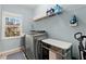 Modern laundry room featuring a front load washer and dryer at 112 Rocky Creek Trl, Woodstock, GA 30188