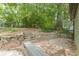 Private backyard with a detached garage and a stone retaining wall at 1748 Alvarado Sw Ter, Atlanta, GA 30310