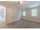 Inviting bedroom featuring plush carpeting, ceiling fan and windows providing ample natural light at 1748 Alvarado Sw Ter, Atlanta, GA 30310