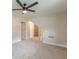 Spacious bonus room with ceiling fan, neutral carpet, and multiple entry points with bright natural light at 1748 Alvarado Sw Ter, Atlanta, GA 30310