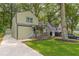 Charming two-story home featuring a covered front porch and well-manicured lawn at 1748 Alvarado Sw Ter, Atlanta, GA 30310