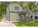 Charming two-story home featuring a covered front porch and well-manicured lawn at 1748 Alvarado Sw Ter, Atlanta, GA 30310