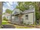 Charming two-story home featuring a covered front porch and well-manicured lawn at 1748 Alvarado Sw Ter, Atlanta, GA 30310