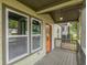 Inviting front porch with decorative railings and a view of the surrounding neighborhood at 1748 Alvarado Sw Ter, Atlanta, GA 30310