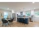 Open-concept kitchen featuring an island with bar stools, stainless appliances, and a breakfast nook at 1748 Alvarado Sw Ter, Atlanta, GA 30310