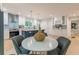 Eat-in kitchen area featuring stainless steel appliances, bright white cabinetry, and a cozy breakfast nook at 1748 Alvarado Sw Ter, Atlanta, GA 30310