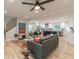 Open-concept living room with hardwood floors, a gray couch, and an open view into the kitchen at 1748 Alvarado Sw Ter, Atlanta, GA 30310