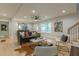 Bright living room features hardwood floors, natural light, modern furniture, and a view to the staircase at 1748 Alvarado Sw Ter, Atlanta, GA 30310