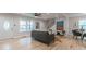 Living room with hardwood floors, stairs, large front windows, and a glimpse into the kitchen at 1748 Alvarado Sw Ter, Atlanta, GA 30310