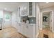 Custom pantry and cabinet area features hardwood floors and access to two other rooms at 1748 Alvarado Sw Ter, Atlanta, GA 30310