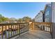 Outdoor balcony showcasing wood railings, wooden floor and the neighboring homes at 310 Mcdonough Se Blvd # 101, Atlanta, GA 30315