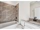 Modern bathroom with tile shower, granite countertop, and white vanity at 310 Mcdonough Se Blvd # 101, Atlanta, GA 30315