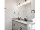 Elegant bathroom vanity with double sinks, granite countertop, and modern lighting at 310 Mcdonough Se Blvd # 101, Atlanta, GA 30315