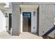 Close-up of modern townhome entrance with stylish black door and visible house number at 310 Mcdonough Se Blvd # 101, Atlanta, GA 30315