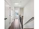 Hallway with wood floors, coat closet and stairwell leading to upstairs bedrooms at 310 Mcdonough Se Blvd # 101, Atlanta, GA 30315