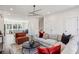 Bright living room with a modern lighting fixture that connects to a kitchen with stainless steel appliances in the background at 310 Mcdonough Se Blvd # 101, Atlanta, GA 30315