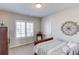 Comfortable bedroom featuring bright window shutters and a warm, neutral color scheme at 3538 Lily Magnolia Ct, Buford, GA 30519