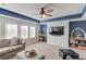 Bonus room featuring a blue ceiling, a ceiling fan, and lots of natural light at 3538 Lily Magnolia Ct, Buford, GA 30519