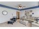 Another view of the bonus room featuring matching furniture and lots of wall decorations at 3538 Lily Magnolia Ct, Buford, GA 30519