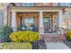 Inviting front porch with rocking chairs and decorative plants, perfect for relaxing at 3538 Lily Magnolia Ct, Buford, GA 30519