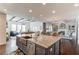 Eat-in kitchen featuring island with stainless steel dishwasher and sink at 3538 Lily Magnolia Ct, Buford, GA 30519